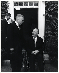 Unidentified man and Mayor John F. Collins outside Massachusetts Hall at Harvard University