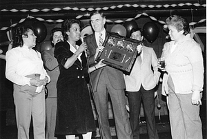 Mayor Raymond L. Flynn receiving a plaque from an unidentified group