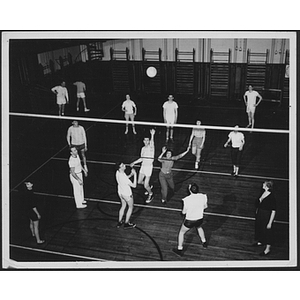 Young adults in a volleyball game