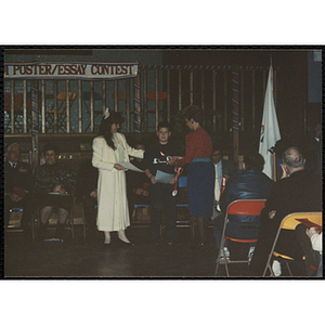 A boy receives an award in the MADD 1991 Poster and Essay Contest