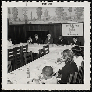 Guests eat and converse, including John G. Magistrelli, seated second from left at the head table, at a Boys' Club Inaugural Dinner