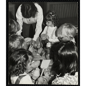 A Group of children and a teacher working on an arts and crafts project