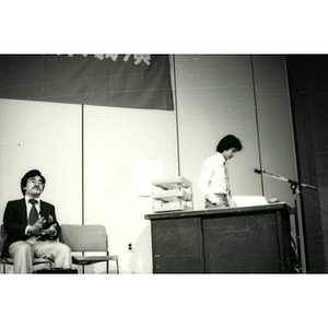 Two men perform in a skit with props at the Chinatown Task Force Fundraiser