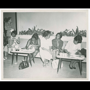 Women filling out paperwork
