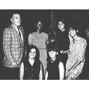 Homecoming Queen candidates pose with Professor Zabilski and King Husky statue