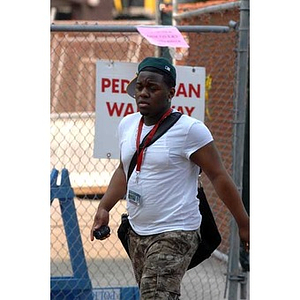 Torch Scholar Ulysses Ifill walks during the scavenger hunt