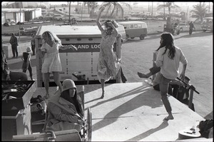 Hollywood Speedway Rock Festival: long-haired men and women dancing energetically at rock concert