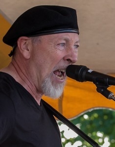 Richard Thompson: close-up portrait singing on stage at the Clearwater Festival