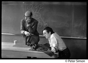 Unidentified man at te podium with Raymond Mungo (right) , United States Student Press Association Congress