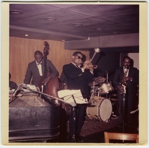 Dizzy Gillespie (trumpet), Chris White (bass), and James Moody (saxophone) performing at the Jazz Workshop