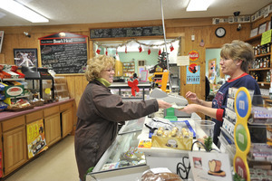 Sales transaction at the counter, New Salem General Store