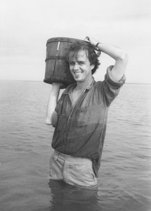 James Tate standing with water with a basket
