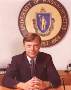 David C. Knapp seated at desk