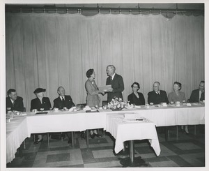 Presentation of a certificate at the Institute for the Crippled and Disabled's 35th anniversary Red Cross luncheon