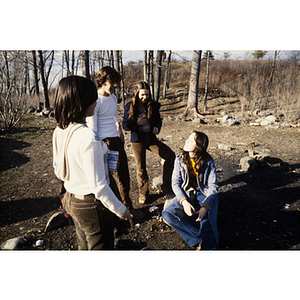 Group of four youths socalizing outside