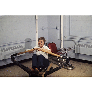 Young person on a rowing machine