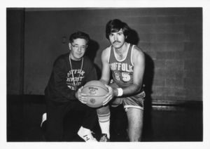 Suffolk University Athletics Director Charles Law, at left, with basketball player Paul Parsons (team captain, 1971-1972), 1972