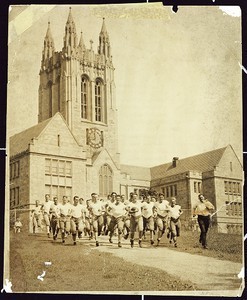 Boston College football team going for a run in front of Gasson Hall