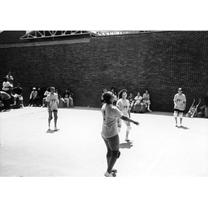 Women playing volleyball.