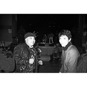 Unidentified Inquilinos Boricuas en Acción staff members standing in the aisle during a Café Teatro performance at the Jorge Hernandez Cultural Center.