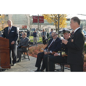 An unidentified man speaks at the Veterans Memorial dedication ceremony