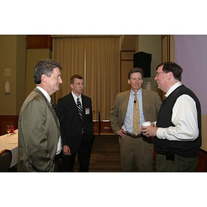 Four men converse at the Training Future Innovators Entrepreneurs Panel