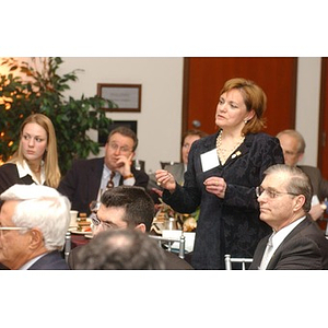 An unidentified woman stands in the audience at The National Council Dinner