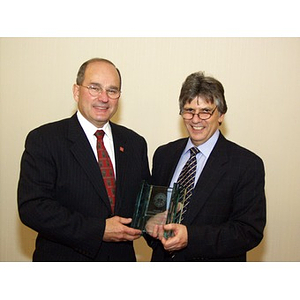 Dr. Ira R. Weiss, right, presents College of Business Administration's Distinguished Service Award to Robert DiCenso, CBA '62