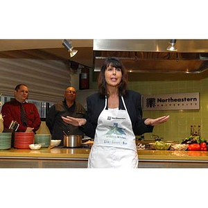 Philomena Mantella speaks when Torch Scholars visit the Exhibition Kitchen