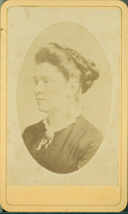Head-and-shoulders portrait of a woman, facing left, location unknown, undated