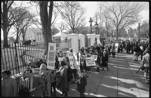 Protesters outside the White House marching against the war in Vietnam, carrying signs demanding return of the troops and end to war: Washington Vietnam March for Peace