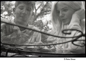 Peter Simon and Karen Helberg pictured through a glass table
