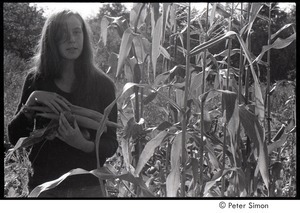 Lacey Mason, holding corn and a tomato, Packer Corners commune