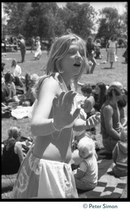 Woman dancing on the lawn during Ram Dass's appearance at Sonoma State University