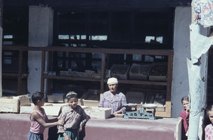 Children at a tea seller's booth