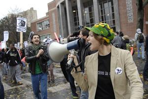 UMass student strike: strike organizer with a bullhorn, leading the march outside the Student Union building