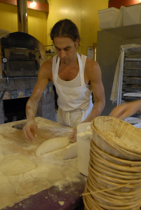 Hungry Ghost Bread: owner and baker Jonathan C. Stevens preparing bread dough