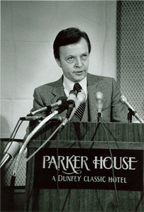 David C. Knapp speaking at a podium with Parker House