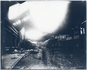 Dudley Street accident, view from street of train cars on street and car lodged in building