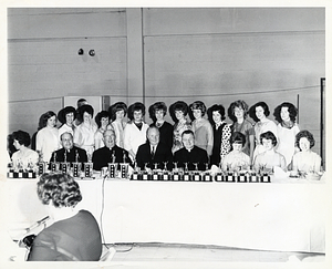 Mayor John F. Collins with group of priests and women at an awards ceremony