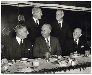 Mayor John F. Collins with four unidentified men at banquet