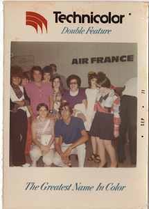 Group poses in front of Air France sign