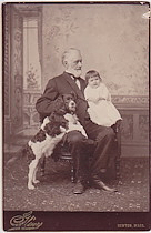 Mr. Henry D. Bassett with grandaughter and dog.