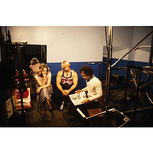 Group of people talk in a gym