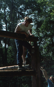 Peter Jensen (upper) and Steven Masters (below) in northwest corner of framing at the Moon Barn Raising at entrance to Hopkins Forest on 2 August 1975.