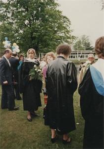 Graduates Beside Peacock Pond.