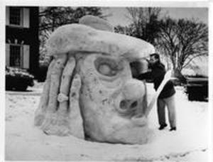 Louis Bortnick works on snow sculpture, 1956