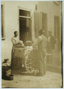 Black woman selling cabbages from a cart in Charleston, South Carolina