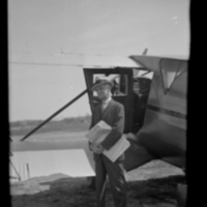 Harvey Cushing beside a Waco airplane before a meeting of the National Academy of Sciences