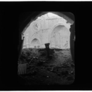 View of damaged cathedral through arch